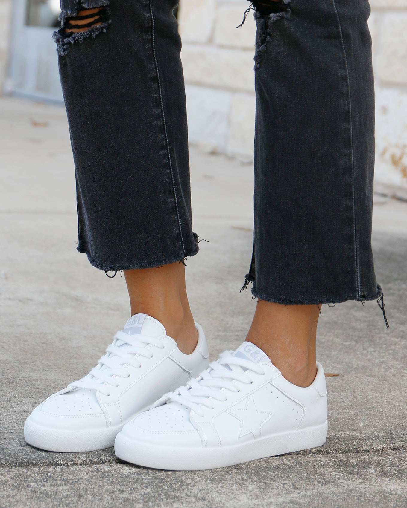 White leather sneakers with sales stars